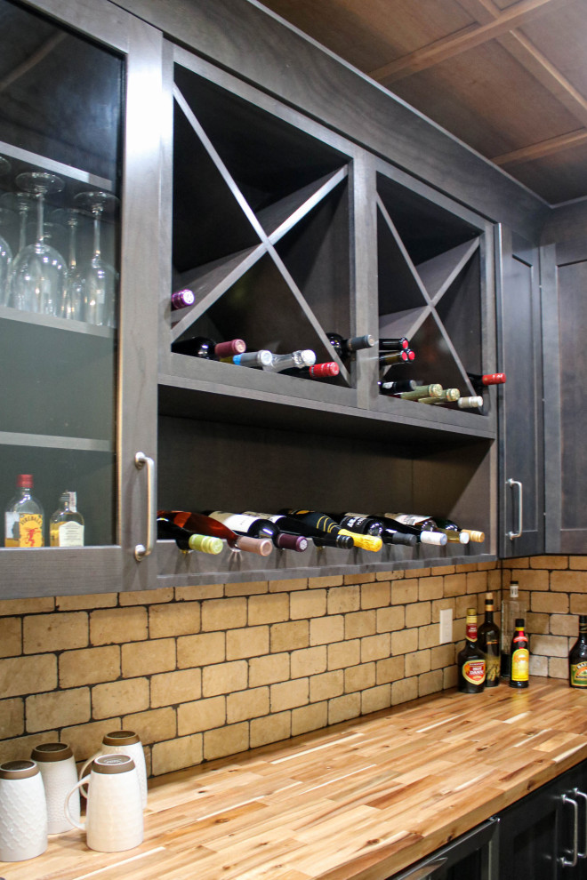 Photo of a small traditional wine cellar in Cleveland with medium hardwood flooring, cube storage and brown floors.