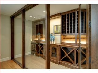Example of a beach style wine cellar design in San Francisco