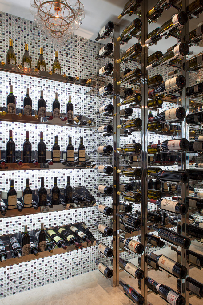 Wine cellar - coastal wine cellar idea in Other with display racks
