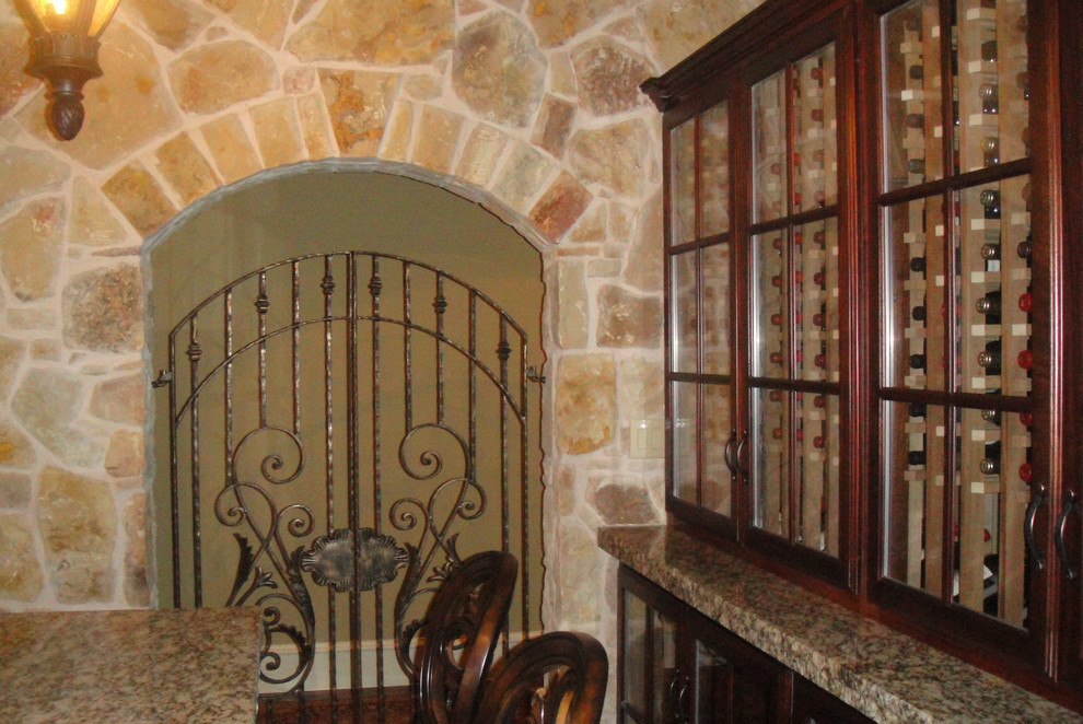 Example of a tuscan wine cellar design in Dallas