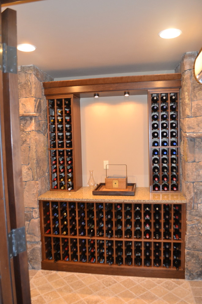 Example of an arts and crafts wine cellar design in Albuquerque