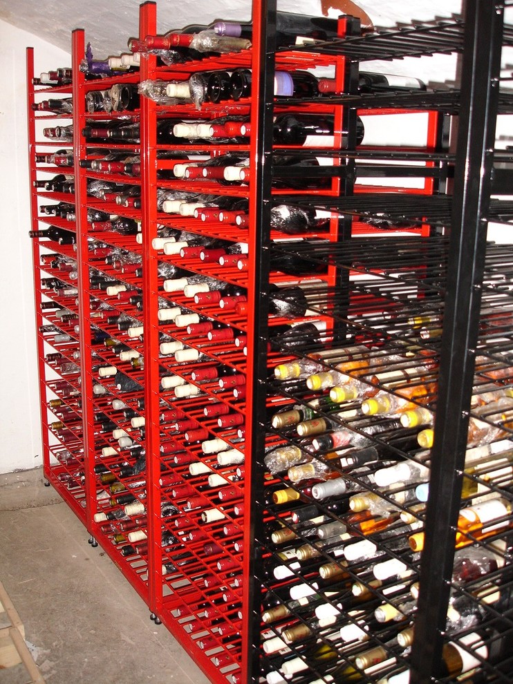 Photo of a contemporary wine cellar in Surrey.