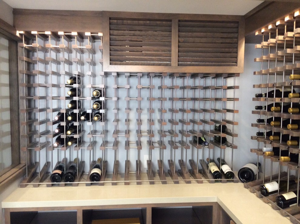 Inspiration for a medium sized contemporary wine cellar in Los Angeles with ceramic flooring and display racks.