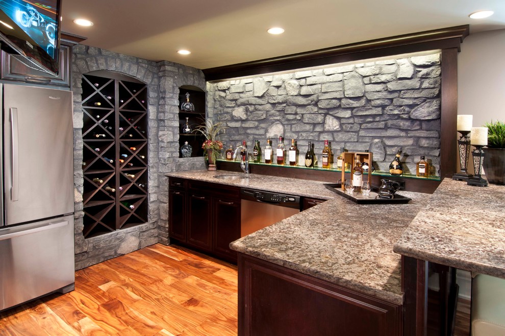 Mid-sized elegant medium tone wood floor wine cellar photo in Calgary with storage racks
