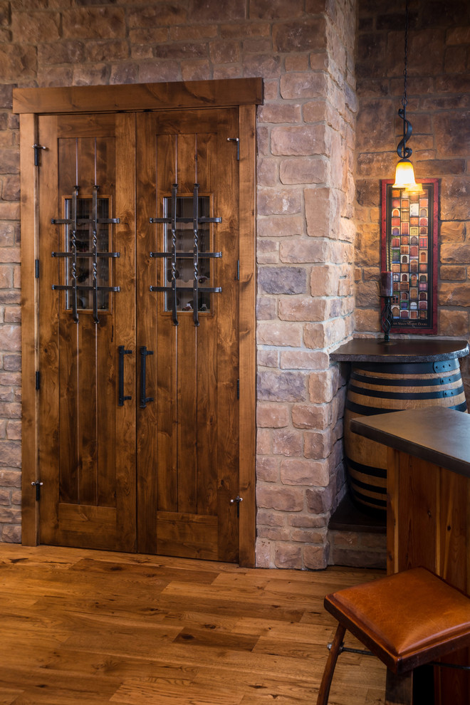 This is an example of a rustic wine cellar in Other.