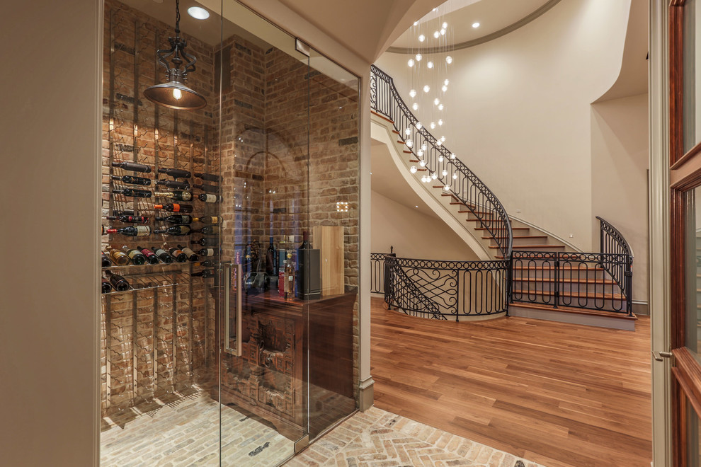 Example of a classic brick floor and beige floor wine cellar design in Dallas with storage racks