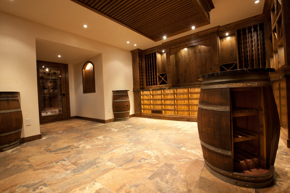 Expansive world-inspired wine cellar in Vancouver with storage racks.