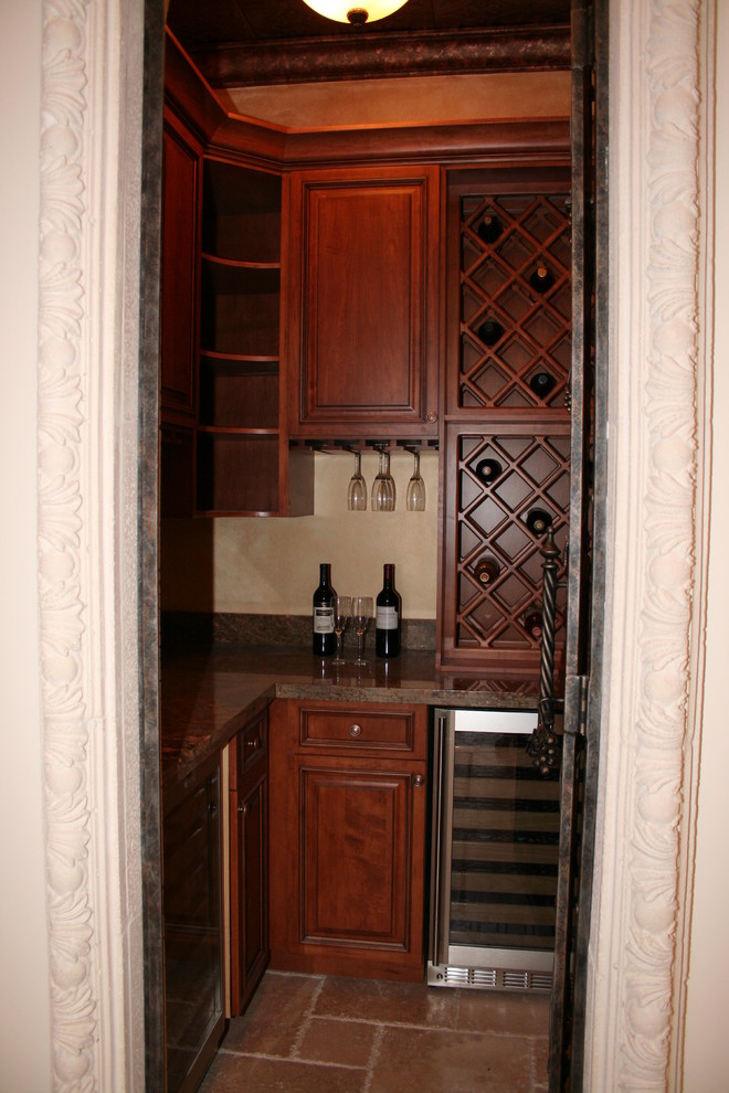 Inspiration for a small classic wine cellar in Miami with travertine flooring and cube storage.