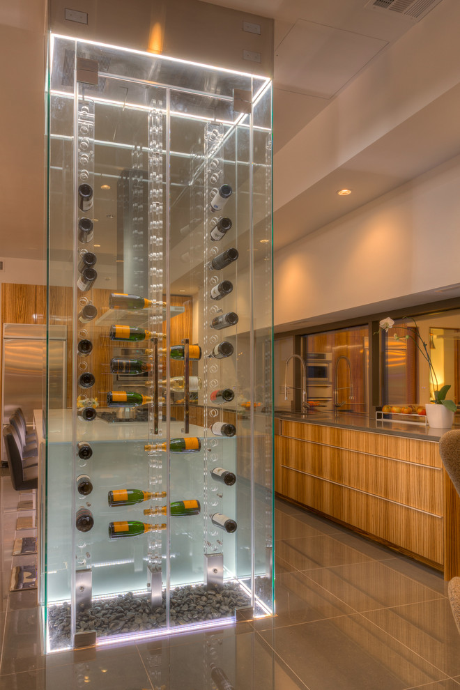 Wine cellar - huge contemporary ceramic tile wine cellar idea in Kansas City with display racks
