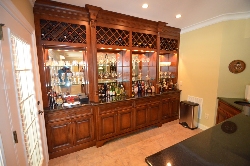 Inspiration for a large timeless limestone floor and beige floor wine cellar remodel in Atlanta with diamond bins