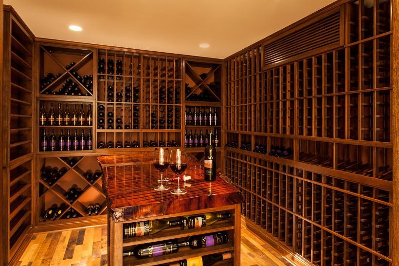 Inspiration for a large timeless light wood floor and yellow floor wine cellar remodel in Boston with storage racks