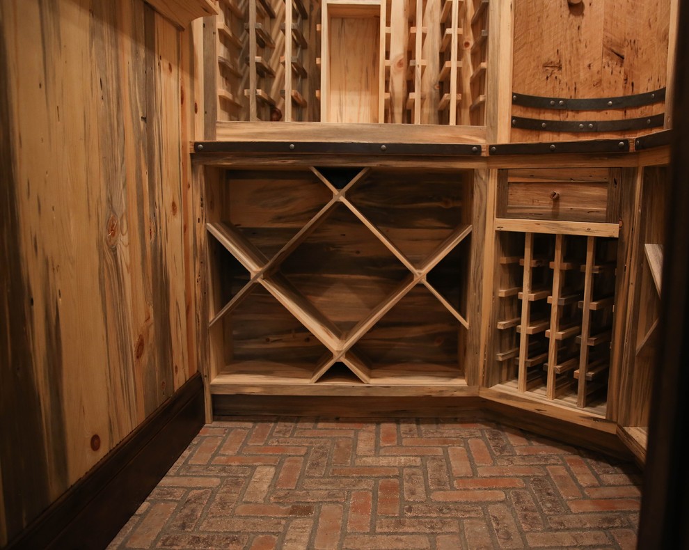 Wine cellar - rustic wine cellar idea in Denver