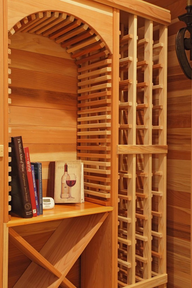 This is an example of a medium sized contemporary wine cellar in Atlanta with storage racks.