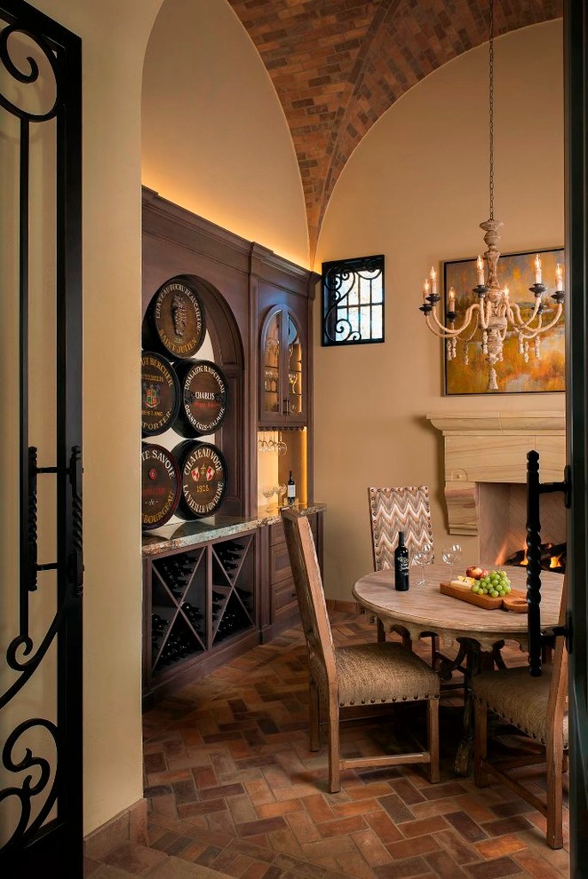 Wine cellar - mid-sized mediterranean brick floor wine cellar idea in Dallas with diamond bins