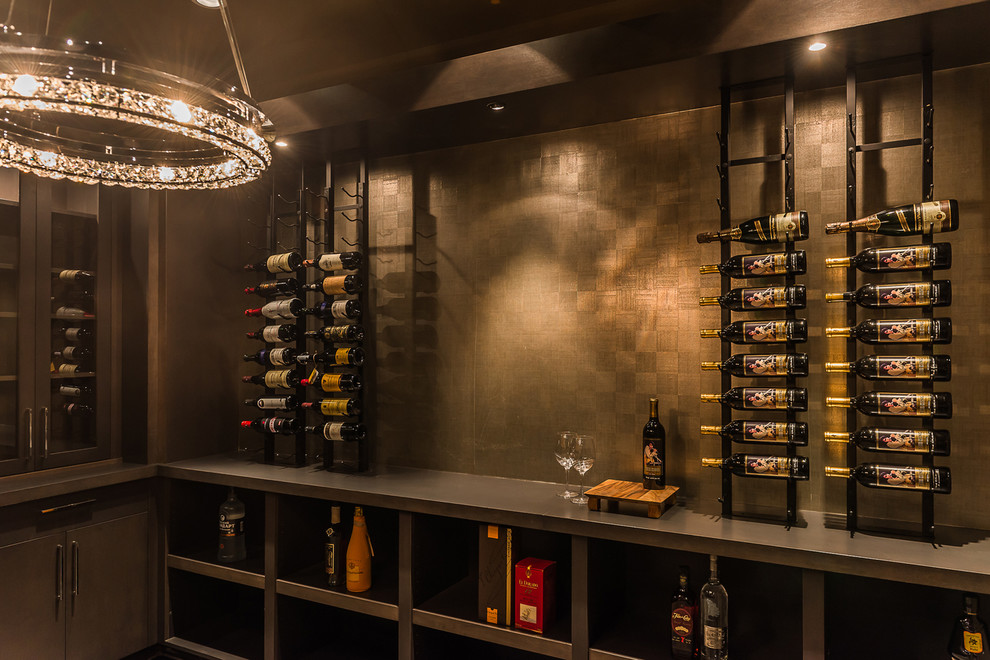 Photo of a modern wine cellar in Vancouver with display racks.
