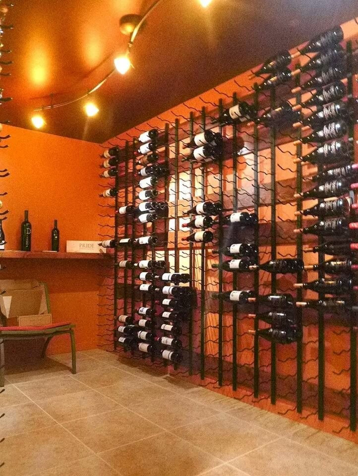 Wine cellar - industrial wine cellar idea in Detroit