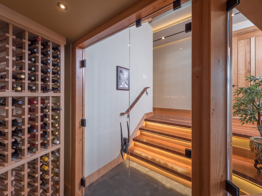 Inspiration for a bohemian wine cellar in Other with ceramic flooring and storage racks.