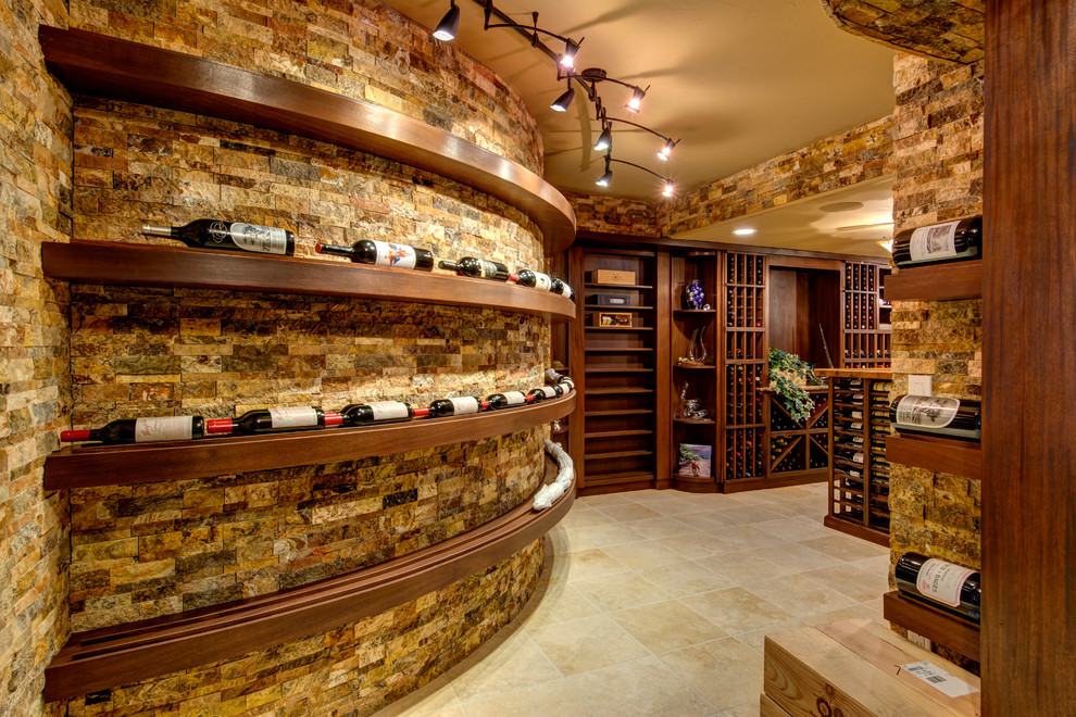 Wine cellar - large traditional wine cellar idea in Denver with display racks