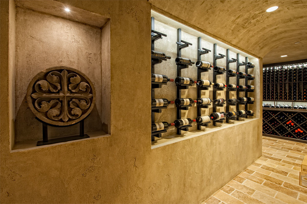 Inspiration for a mediterranean wine cellar in Vancouver with display racks.