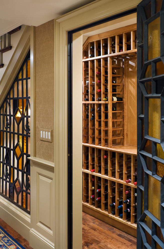 Design ideas for a medium sized classic wine cellar in New York with medium hardwood flooring and storage racks.