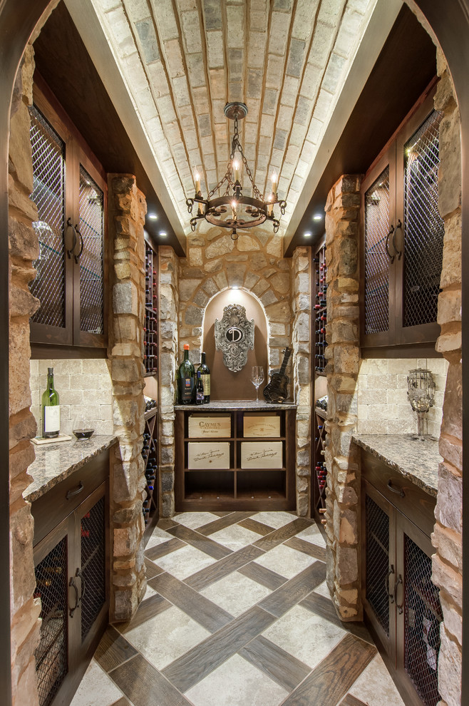 Photo of a mediterranean wine cellar in Nashville with multi-coloured floors.