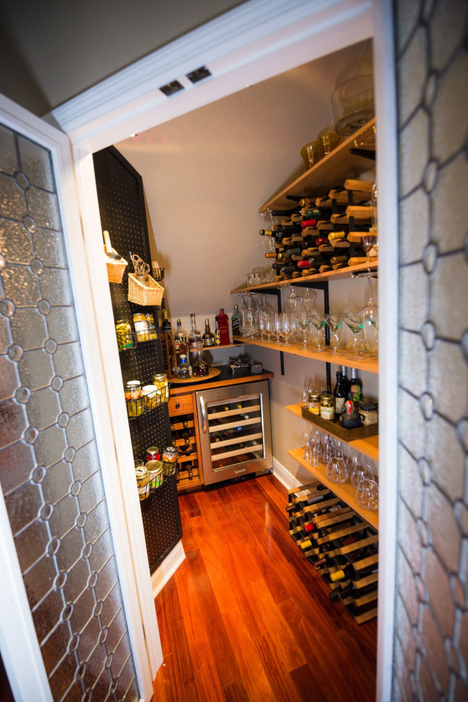 Wine cellar - transitional wine cellar idea in Tampa