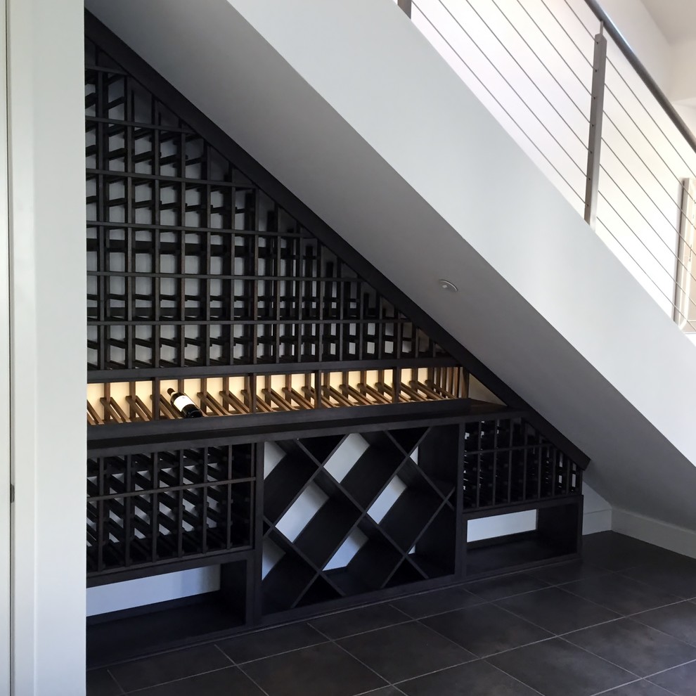 Design ideas for a small traditional wine cellar in Los Angeles with display racks.