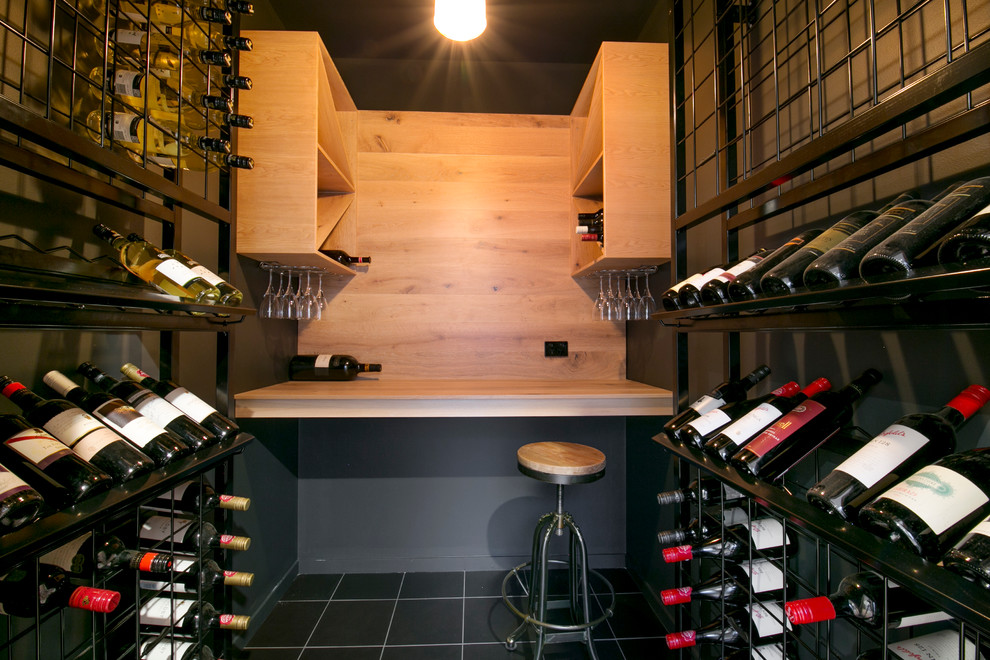 Design ideas for a small industrial wine cellar in Brisbane with ceramic flooring and storage racks.