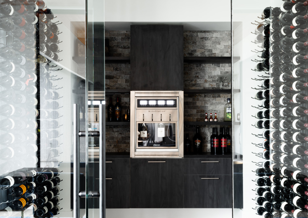 Example of a mid-sized trendy brown floor wine cellar design in Houston with display racks