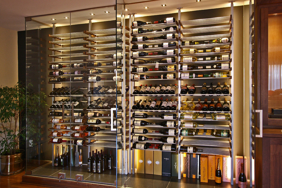 Medium sized contemporary wine cellar in Phoenix with display racks, ceramic flooring and grey floors.