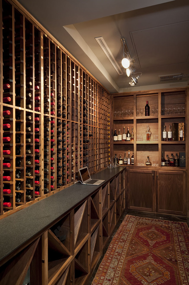 This is an example of a traditional wine cellar in Austin with storage racks.