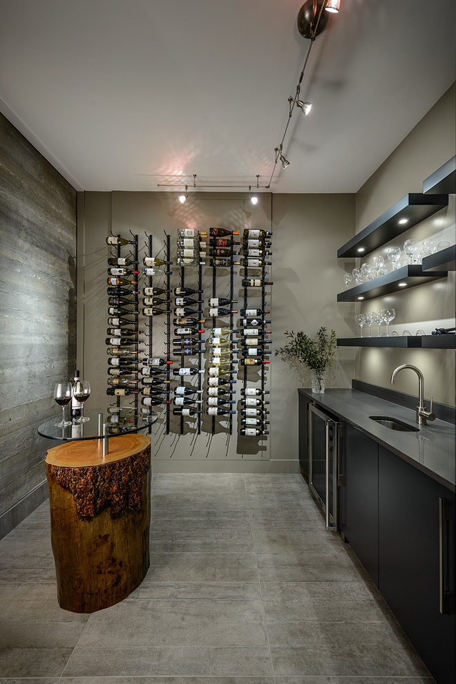 Photo of a contemporary wine cellar in Vancouver with concrete flooring and grey floors.