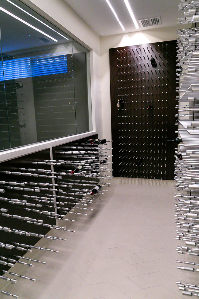 This is an example of a medium sized contemporary wine cellar in Chicago with display racks.