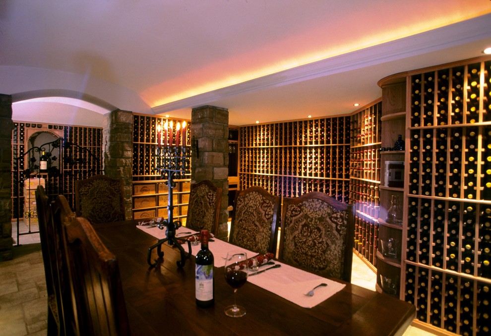 Example of a large trendy slate floor wine cellar design in New York with storage racks