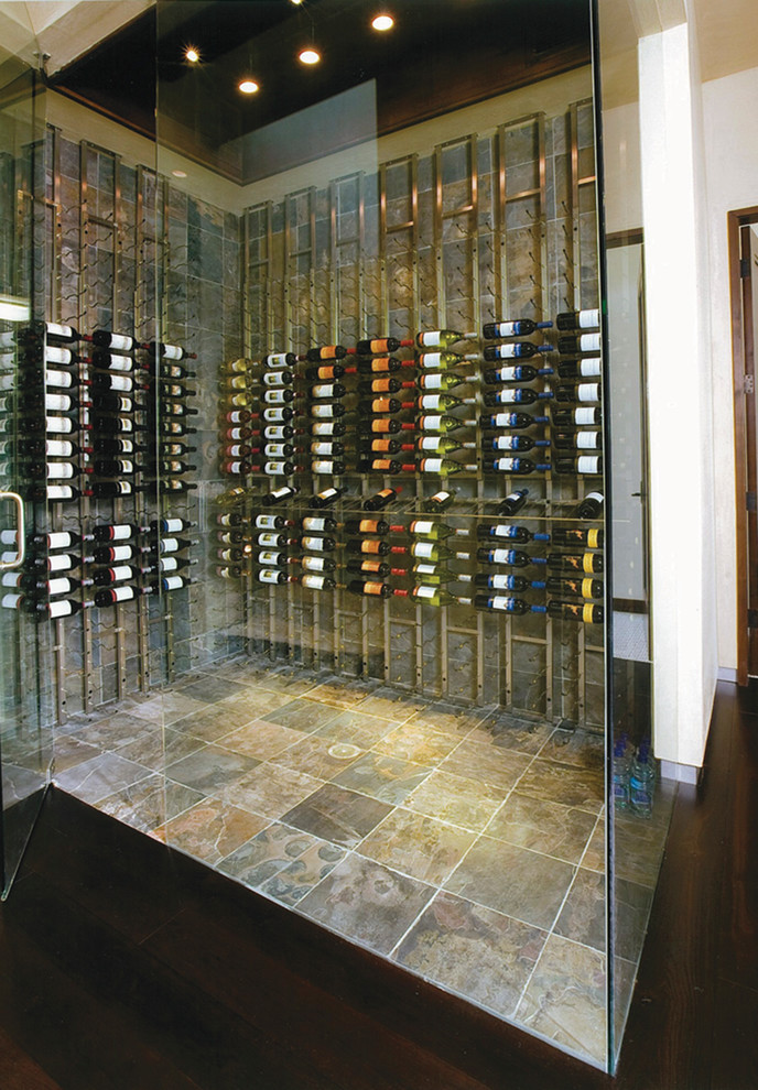 Inspiration for a mid-sized contemporary slate floor wine cellar remodel in Denver with storage racks