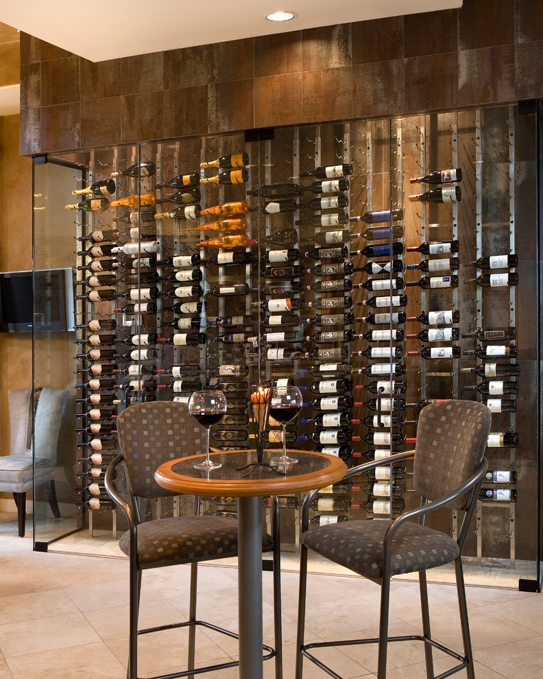 Example of a mid-sized trendy porcelain tile and beige floor wine cellar design in Phoenix with display racks