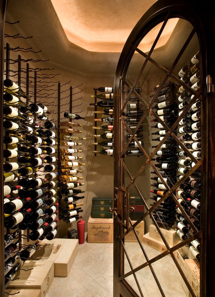 Design ideas for a medium sized contemporary wine cellar in Phoenix with display racks, concrete flooring and brown floors.