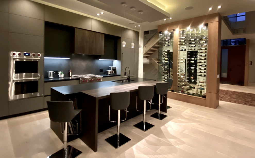 This is an example of a small contemporary wine cellar in Providence with display racks.