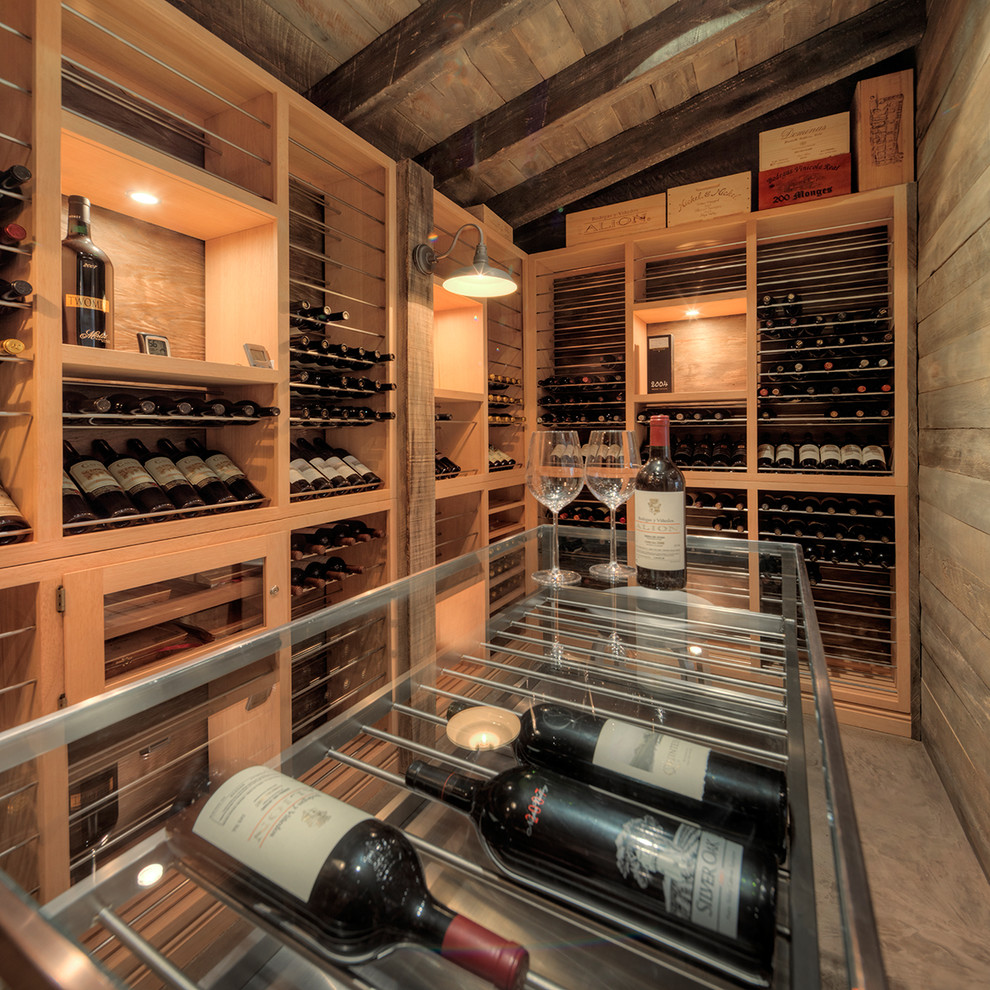 Mid-sized transitional wine cellar photo in Miami with display racks