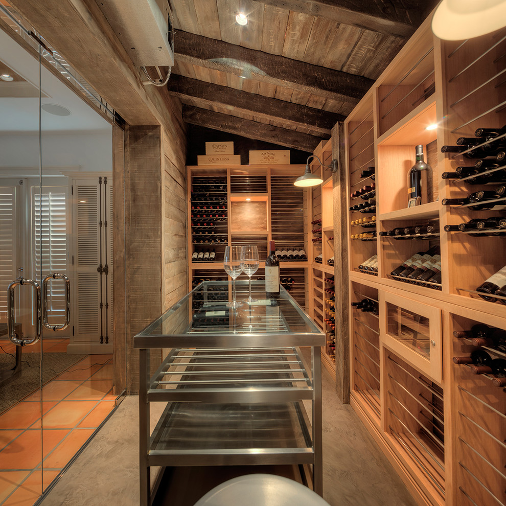 Wine cellar - mid-sized transitional wine cellar idea in Miami with display racks