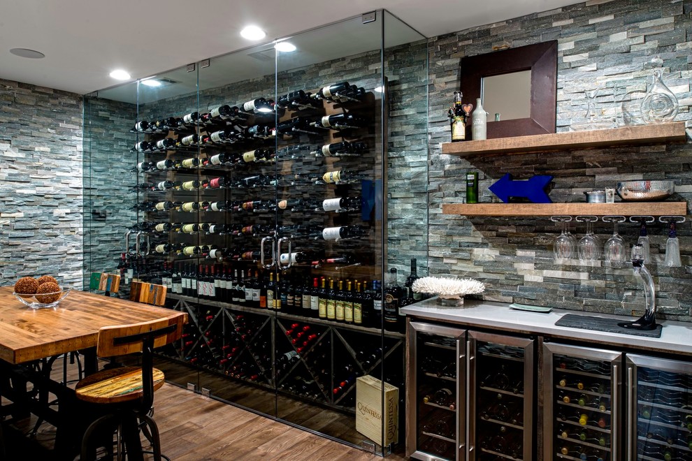 Wine cellar - huge contemporary medium tone wood floor and brown floor wine cellar idea in Atlanta with storage racks