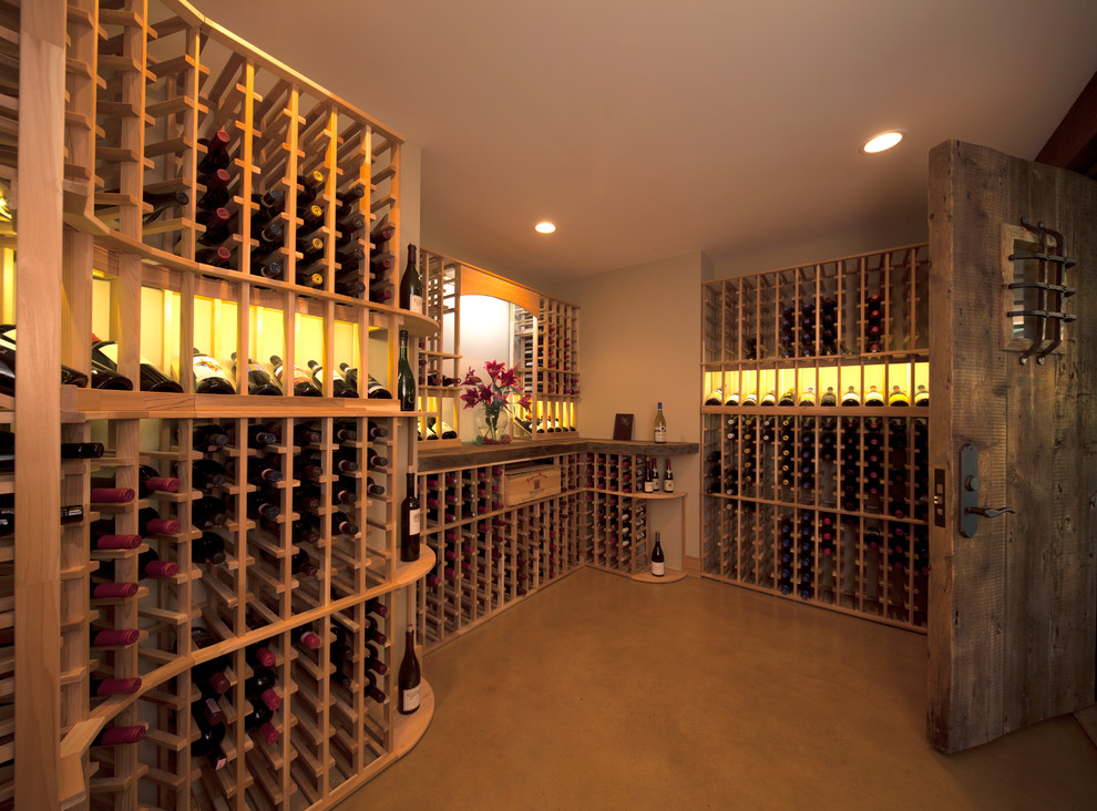 This is an example of a rustic wine cellar in Minneapolis with storage racks.