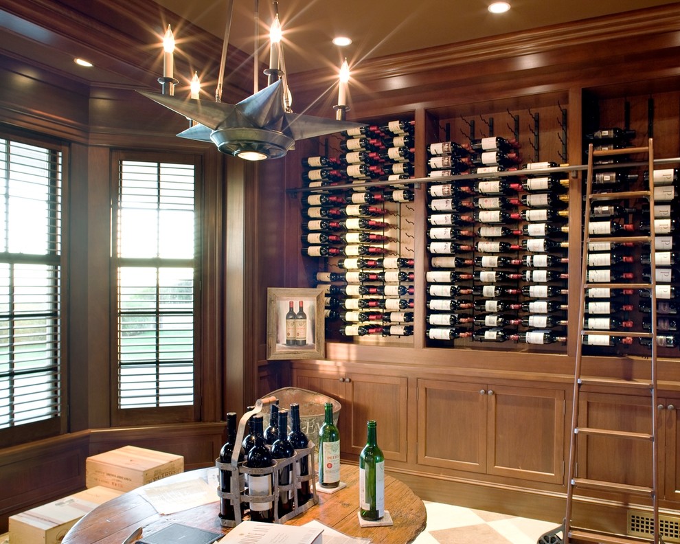 This is an example of a large nautical wine cellar in Boston with ceramic flooring and storage racks.