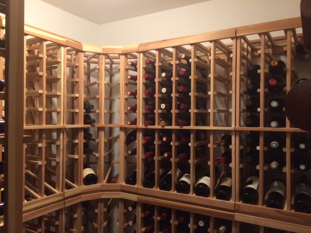 This is an example of a small classic wine cellar in Minneapolis with storage racks.