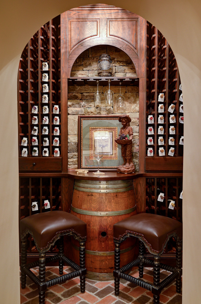 Example of a tuscan wine cellar design in Atlanta