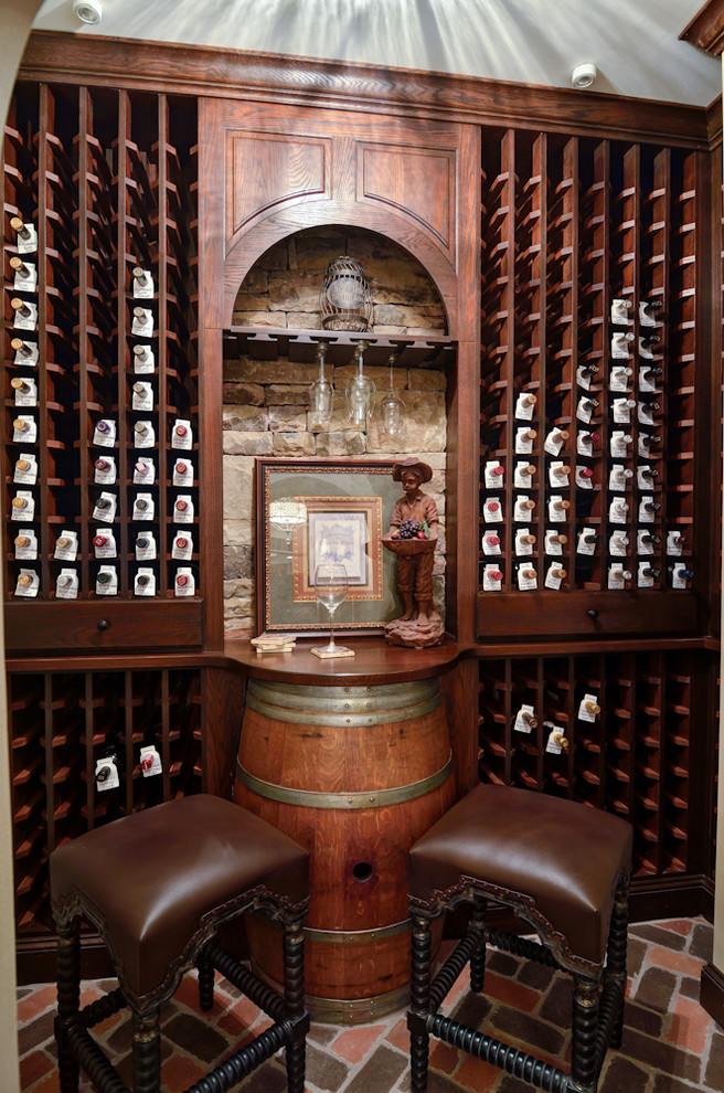 Inspiration for a rustic wine cellar in Atlanta with brick flooring, storage racks and red floors.