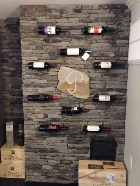 Example of an arts and crafts wine cellar design in Raleigh
