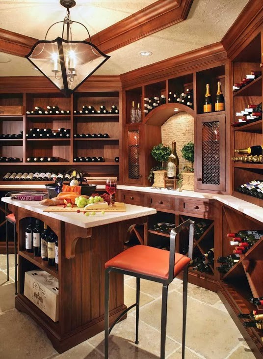 This is an example of a large rustic wine cellar in Miami with travertine flooring and storage racks.