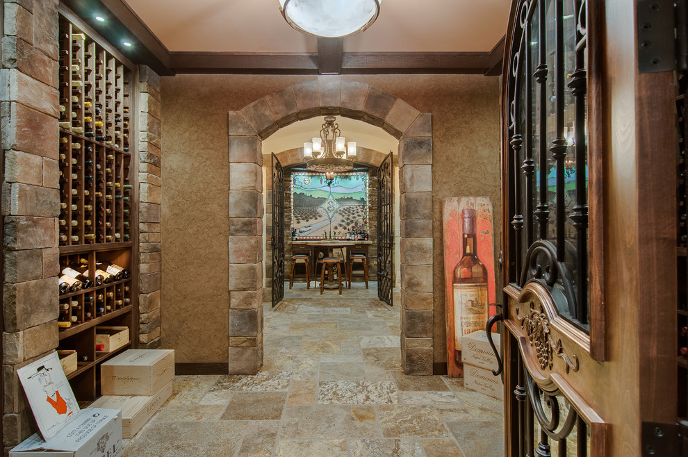 Mid-sized mountain style ceramic tile and beige floor wine cellar photo in Nashville with storage racks