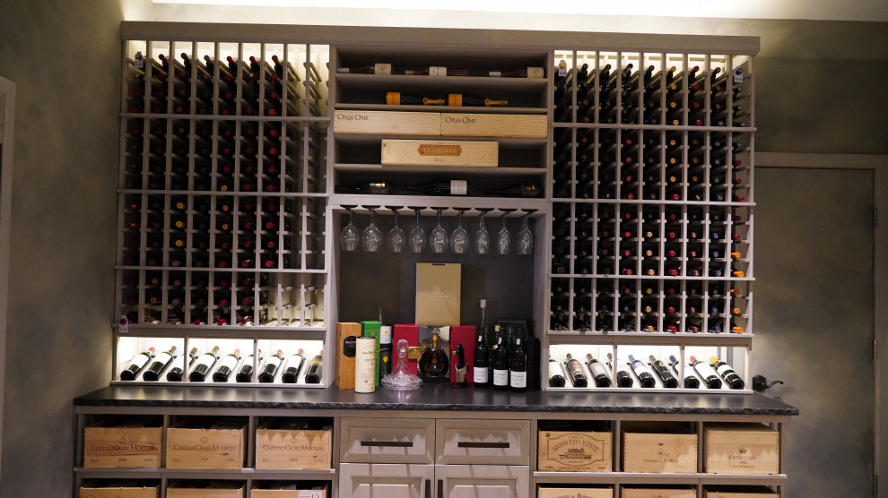 This is an example of a medium sized contemporary wine cellar in New York with storage racks.